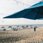 Best Summer Film Recipes For Fujifilm Cameras - Blue sunshade by the beach