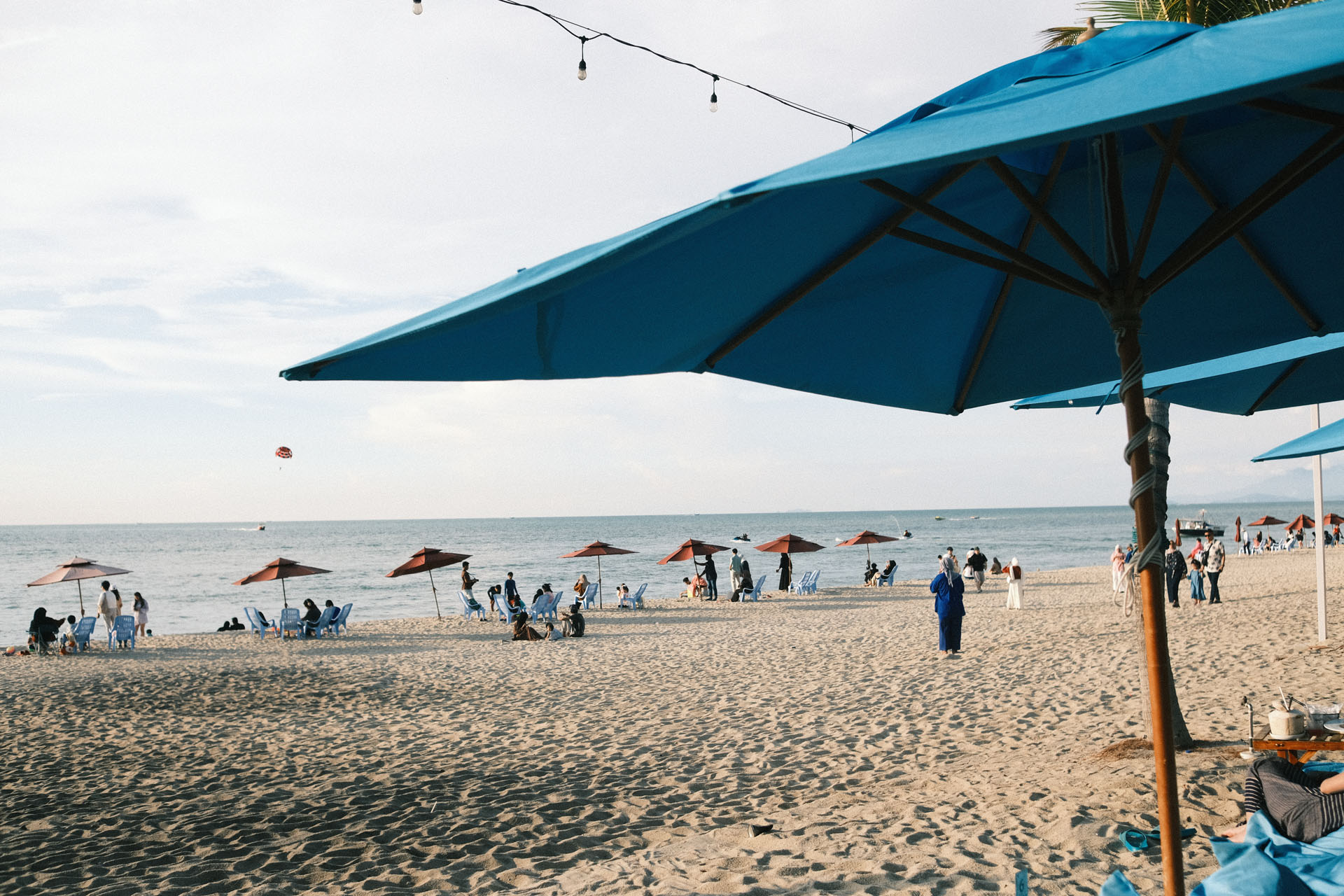Best Summer Film Recipes For Fujifilm Cameras - Blue sunshade by the beach