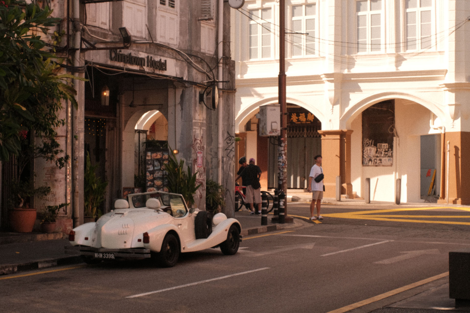 Ginza 1980 - Best Film Recipes For Summer Photography - A vintage car parked at roadside beside an old building with golden hour