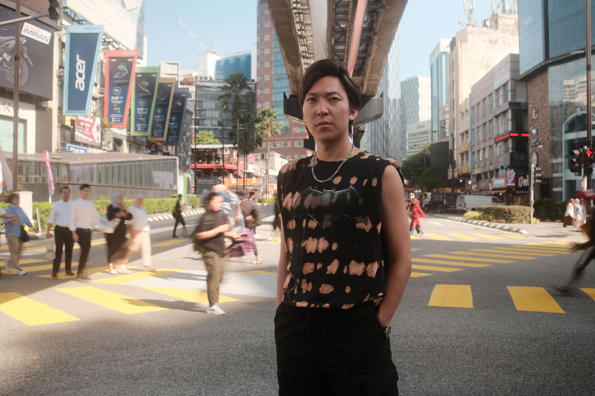 Hands-in-pocket pose for men in casual street photography
