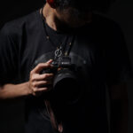 Photographer holding camera using AI tools for visual storytelling