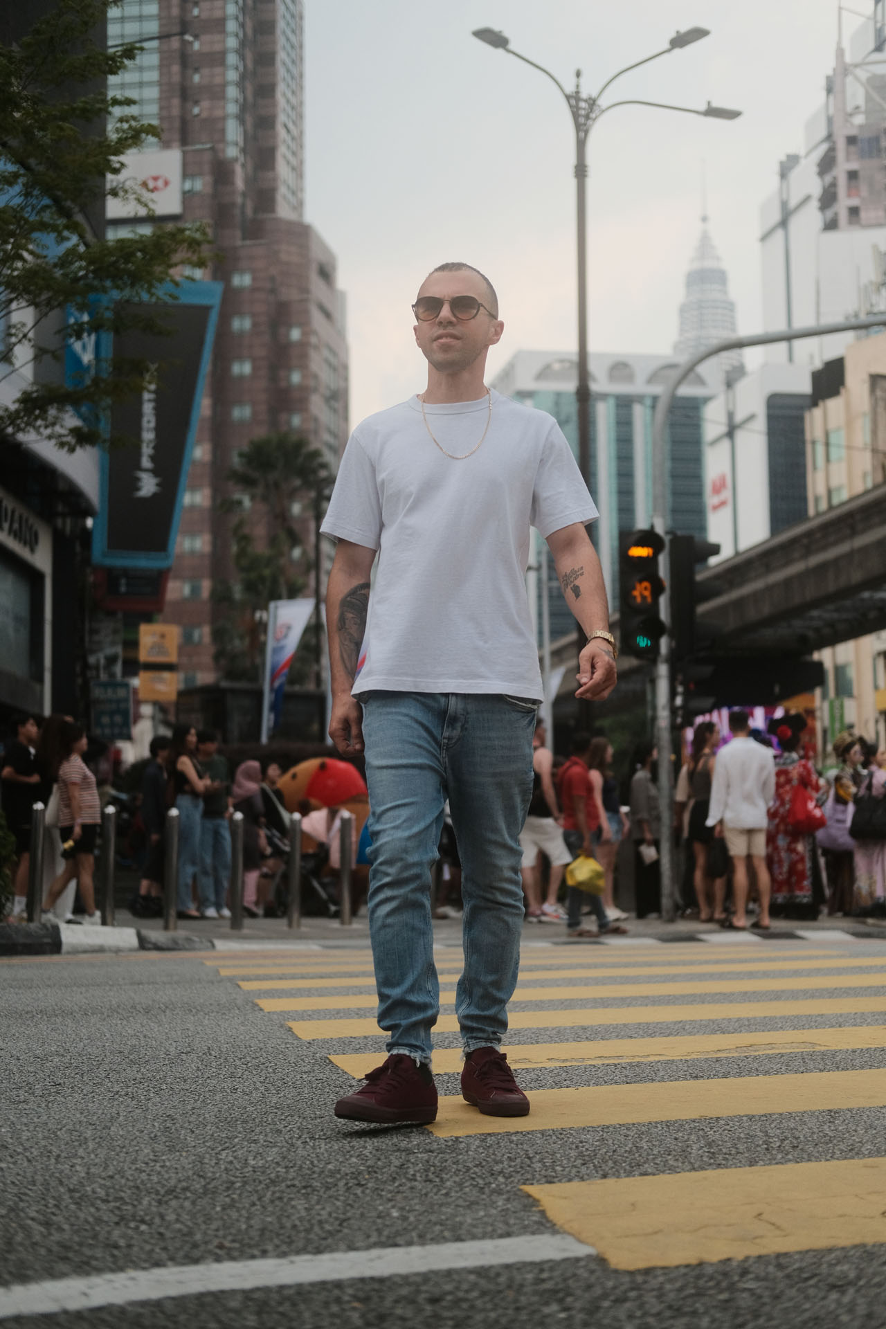 Walking shot of a man in urban street setting