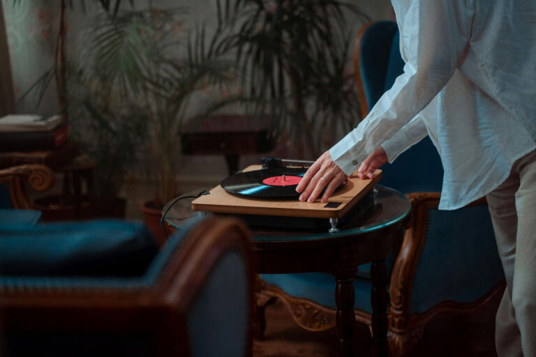 Vinyl Myths Busted - A person playing vinyl record on turntable