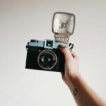 The Best Toy Cameras for Creative Lo-fi Photography - A person holding the Diana F+ film camera